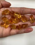 Orange Yellow AAA citrine raw rough pieces in hand