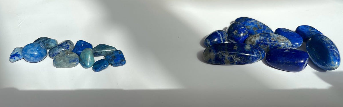 Natural and dyed blue tumbled stones side by side - how treatment changes crystal color