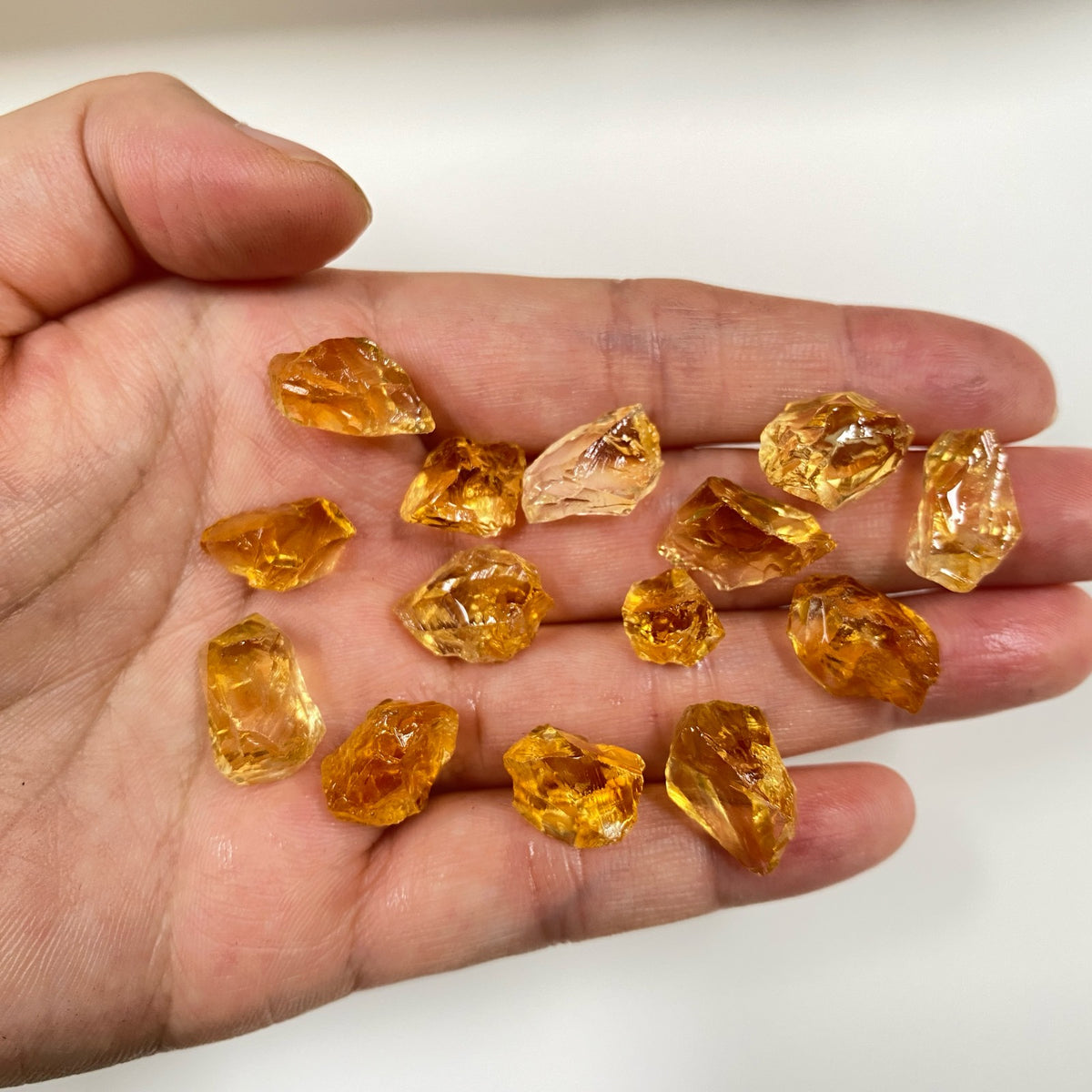 Golden Yellow AAA citrine raw rough pieces in hand