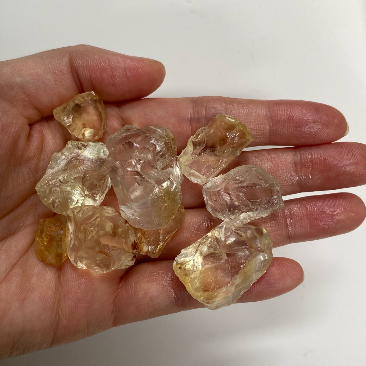Light Lemon Yellow AAA citrine raw rough pieces in hand