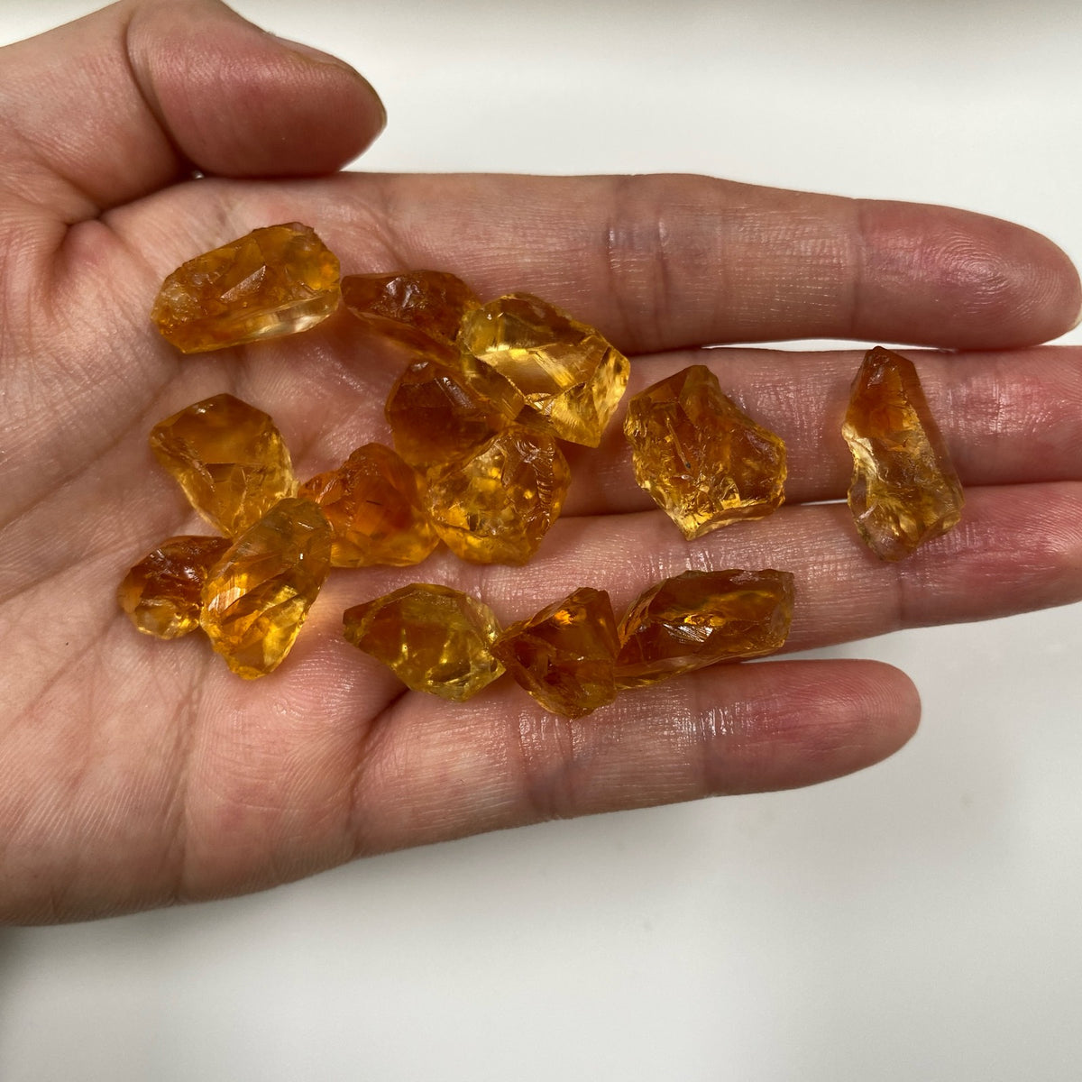 Orange Yellow AAA citrine raw rough pieces in hand